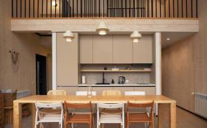 a dining room with a wooden table and chairs at Samatha space in Slavske +22 photos