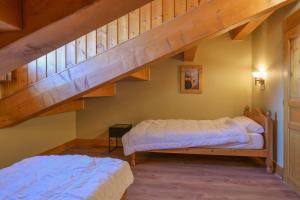 En eller flere senge i et værelse på lesetoilesdelaplagne Chalet 20