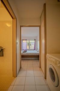 Ένα ή περισσότερα κρεβάτια σε δωμάτιο στο Dunes Apart-Hotel - Kiwi Residence