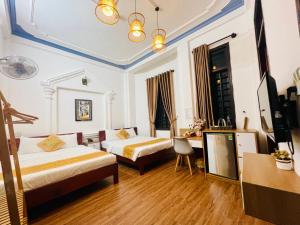 Ένα ή περισσότερα κρεβάτια σε δωμάτιο στο Eva Homestay +75 φωτογραφίες