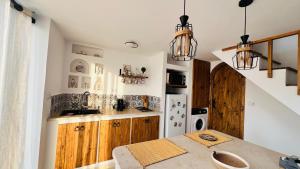 a kitchen with a sink and a counter top at Dar Aicha Marina Hammamet Sud in Hammamet +8 photos