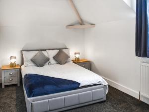 Postel nebo postele na pokoji v ubytování Faith Cottage