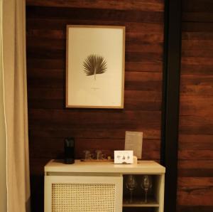 a table with a picture on a wooden wall at Isla Clara Hotel in San Francisco +45 photos