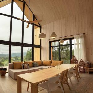 a living room with a couch and a table at Samatha space in Slavske