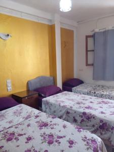 En eller flere senge i et værelse på Enjoy Ghardaia Stay