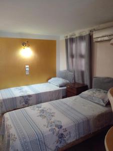 En eller flere senge i et værelse på Enjoy Ghardaia Stay