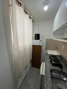 Kuchyň nebo kuchyňský kout v ubytování Studio Aconchegante