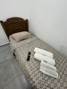 Postel nebo postele na pokoji v ubytování Studio Aconchegante