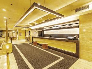 a lobby with a reception desk in a building at New Osaka Hotel in Osaka