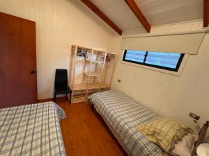 Postel nebo postele na pokoji v ubytování Cabañas entre Talca y Maule, en Piedras Blancas