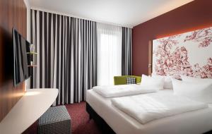 Ένα ή περισσότερα κρεβάτια σε δωμάτιο στο Das Karl