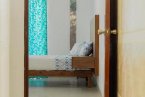 a bedroom with a bunk bed with a mirror at Departamentos Blue Bacalar in Bacalar