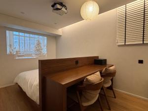 Postel nebo postele na pokoji v ubytování 무무 mumu