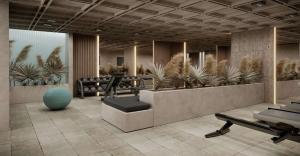 ein Fitnessraum mit Trainingsgeräten und Pflanzen in der Unterkunft Aethra in Nydri