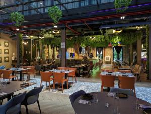 a restaurant with tables and chairs in a building at La Cuadra - Casco Viejo in Panama City
