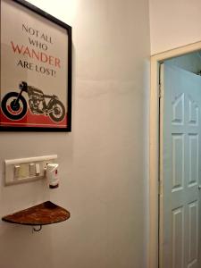 a picture of a motorcycle on a wall next to a door at Casa Bela in Canacona +1 photo
