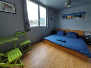 Ένα ή περισσότερα κρεβάτια σε δωμάτιο στο Chambre en Seine chez Philippe