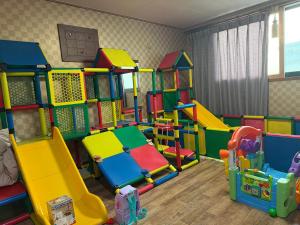 a play room with many different types of play equipment at Yangji Resortel in Hwaseong