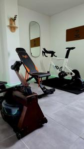 a gym with two exercise bikes in a room at Best Western Plus La Corniche in Toulon