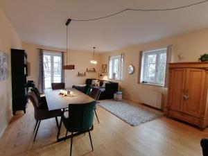 a living room with a table and chairs at Allgäu-Idyll in Weiler-Simmerberg