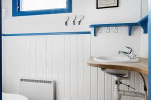 a bathroom with a sink and a toilet at HAL657-Knaered-Bjoerkered-72 in Körsveka +14 photos