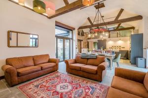 a living room with two couches and a dining room at 3 Bed in Dulverton oc-t32975 in Dulverton