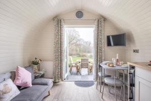 a living room with a couch and a table at 1 Bed in Llanfyllin oc-p29023 in Llanfyllin +14 photos