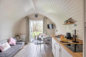 a kitchen and living room in a tiny house at 1 Bed in Llanfyllin oc-p29023 in Llanfyllin