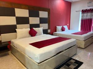 Postel nebo postele na pokoji v ubytování Hotel New Rajdarshan + 8 fotografií