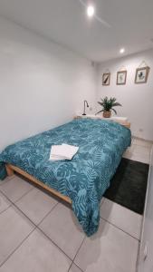 En eller flere senge i et værelse på NALAN Orrygeois, SPA, Sauna, Proche Asterix