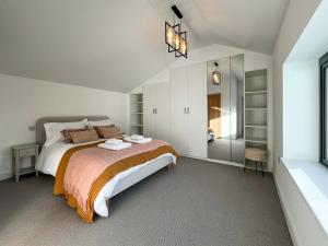 En eller flere senge i et værelse på Penlee Retreat