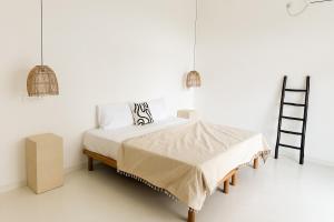 En eller flere senge i et værelse på Soleya Boutique Villa