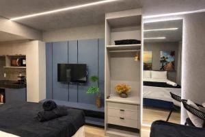 a bedroom with a bed and a large mirror at Setai Yatch - Praia in João Pessoa