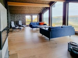 Et opholdsområde på Luxury Mountain Home With View On Gaustablikk