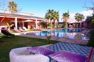 a resort with a swimming pool and a house at Villa Essalah & Spa Marrakech in Marrakech +42 photos