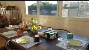 a table with a tray of food on top of it at Chambres sur Seine Megalight2 in Sèvres +31 photos