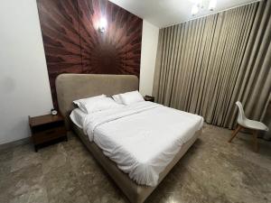 Postel nebo postele na pokoji v ubytování Mazaya VIP Stay