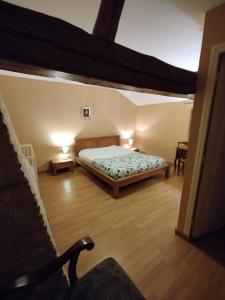 Postel nebo postele na pokoji v ubytování Gîte Chez Albertine