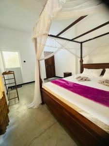 Postel nebo postele na pokoji v ubytování Lyra Mirissa