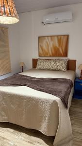 Postel nebo postele na pokoji v ubytování Recanto Doce Lar