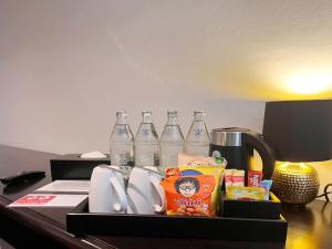a tray of food and drinks on a desk at Bangluang Boutique Hotel in Bangkok