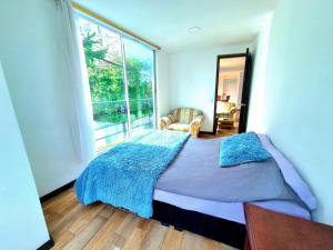 En eller flere senge i et værelse på Espectacular Apartamento en San Martín