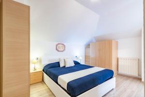 Postel nebo postele na pokoji v ubytování Appartamento Mansarda Bellaria - MyHo Casa