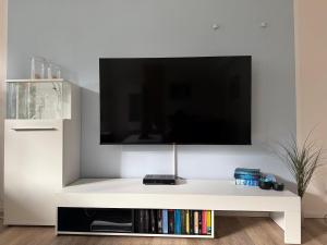 TV/trung tâm giải trí tại Ferienwohnungen First Bismarck