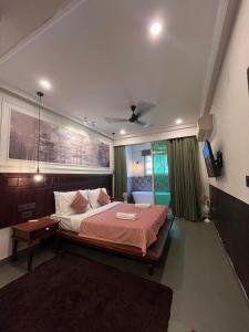 Postel nebo postele na pokoji v ubytování Hotel Dimaru Boutique,Calangute Beach