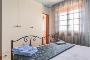 Postel nebo postele na pokoji v ubytování B&B Il Mirto