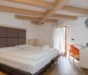 Postel nebo postele na pokoji v ubytování Cameras Mori