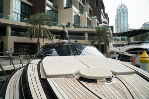 a police car parked in front of a building at Yacht Azimut Atlantis 50 in Dubai