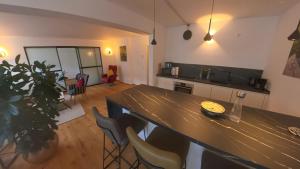 a kitchen with a table and chairs in a room at Erftstege#3 in Bad Münstereifel