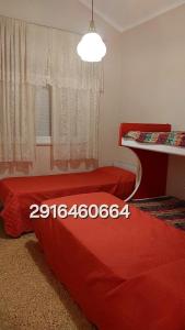 En eller flere senge i et værelse på Atenea